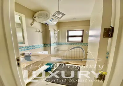 a bathroom with a sink and a mirror at Tawila Villa T1-15 in Hurghada