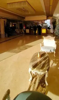 a room with a table and chairs in a building at Casablanca Beach Hurgada in Hurghada