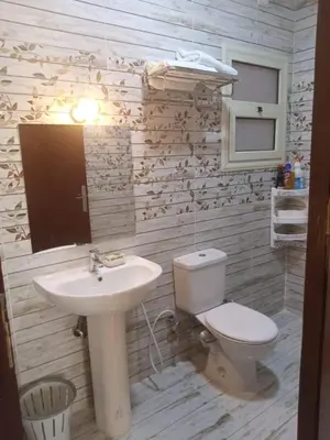 a bathroom with a toilet and a sink at Casablanca Beach Hurgada in Hurghada