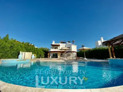 a large swimming pool in front of a building at Villa 9 ph-5 with 4 Bed Room in Hurghada