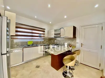 a kitchen with a counter and a refrigerator at Villa 9 ph-5 with 4 Bed Room in Hurghada