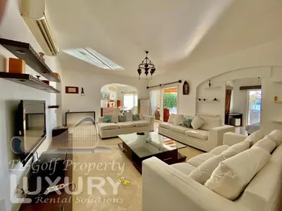 a living room with white furniture and a chandelier at Villa 9 ph-5 with 4 Bed Room in Hurghada
