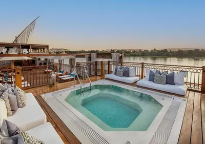 a deck with a hot tub on a boat at Dahabeya Molouky Nile Cruise- Every Monday from Luxor- Aswan for 05 nights in Luxor