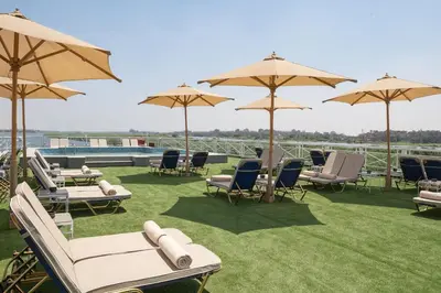 a group of chairs and umbrellas on a roof at Jaz Elite Regent Nile Cruise - Every Monday from Luxor for 07 & 04 Nights - Every Friday From Aswan for 03 Nights in Luxor