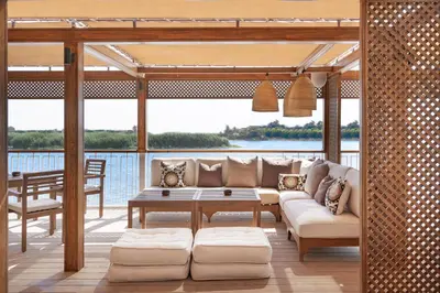 a living room with a couch and a table at Jaz Viceroy Nile Cruise - Every Saturday from Luxor for 07 & 04 Nights - Every Wednesday From Aswan for 03 Nights in Luxor