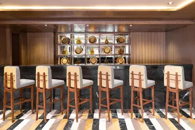 a bar in a room with a bunch of chairs at Jaz Viceroy Nile Cruise - Every Saturday from Luxor for 07 & 04 Nights - Every Wednesday From Aswan for 03 Nights in Luxor