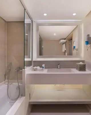 a bathroom with a sink and a shower and a mirror at Jaz Viceroy Nile Cruise - Every Saturday from Luxor for 07 & 04 Nights - Every Wednesday From Aswan for 03 Nights in Luxor