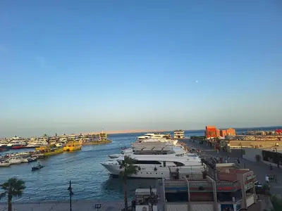 a group of boats are docked in a harbor at new marina heart of Hurghada in Hurghada
