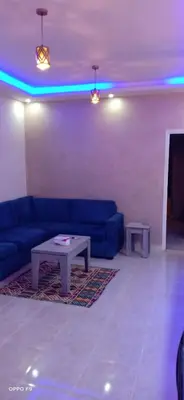 a living room with a couch and a table at la vi -panorama sea in Hurghada