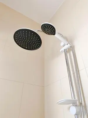 a shower with two shower heads on the ceiling at Modern Mountain View on The Touristic Promenade in Hurghada