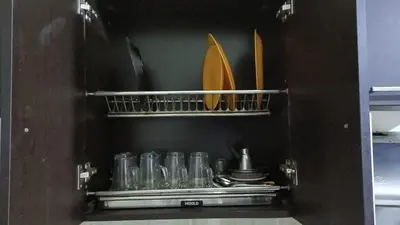 a shelf with glasses and other items in a kitchen at Tiba Resort F22 Near to ElGouna in Hurghada
