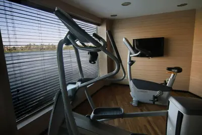 a room with a gym with a treadmill and a window at Le Fayan Nile Cruise - Every Monday from Luxor for 4 & 7 Nights, and every Friday from Aswan for 3 & 7 Nights in Luxor