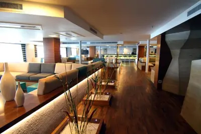 a large living room with couches and tables at Le Fayan Nile Cruise - Every Monday from Luxor for 4 & 7 Nights, and every Friday from Aswan for 3 & 7 Nights in Luxor