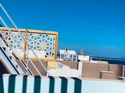 a view of the city from the roof of a building at Cozy Apartment in Qadd el-Barûd
