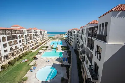 an aerial view of a resort with a swimming pool at Premium sea view 2 bedrooms 2 bathrooms apartment located within Gravity Hotel & Aquapark Hurghada in Hurghada