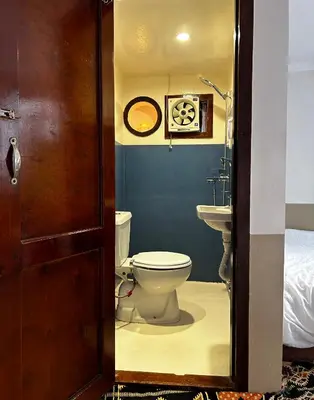 a bathroom with a toilet and a sink at Houseboat Hotel and Nile Cruises Zainoba in Aswan