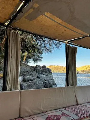 a view of the water from the inside of a tent at Houseboat Hotel and Nile Cruises Zainoba in Aswan