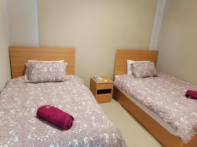 two beds in a small room with sidx sidx sidx at Tawila, 4 Bedroom Villa, Brand new, directly on a lagoon in Hurghada