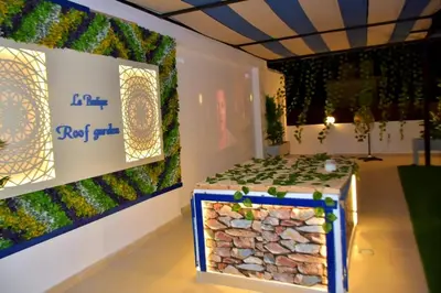 a room with a table with plants on it at La Boutique Residence in Hurghada