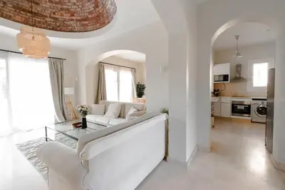 a living room with a white couch and a glass table at Modern Villa in El Gouna (Private Pool & Garden.) in Hurghada