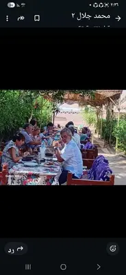 a group of people sitting at a long table at Nour El Balad in Luxor