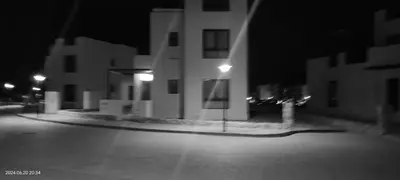 a black and white photo of a building at night at Villa for you on your own in Makadi Heights, Hurghada, Read Sea, Egypt in Hurghada