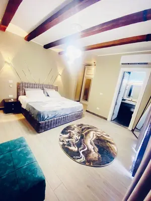 a large bedroom with a bed and a rug at LuxVilla 1 BHK W Private Heated Pool in Bali El Gouna in Hurghada
