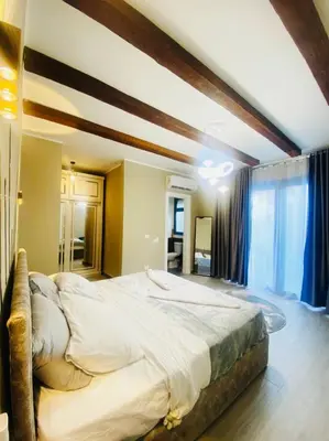 a bedroom with a large bed in a room at LuxVilla 1 BHK W Private Heated Pool in Bali El Gouna in Hurghada