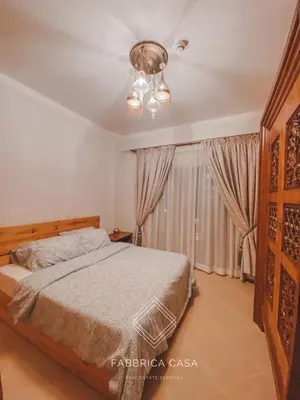 a bedroom with a bed and a ceiling fan at Beautiful 1 bedroom apartment in Quseir