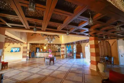 a lobby of a building with a table in the middle at Marina view port ghalib in Port Ghalib