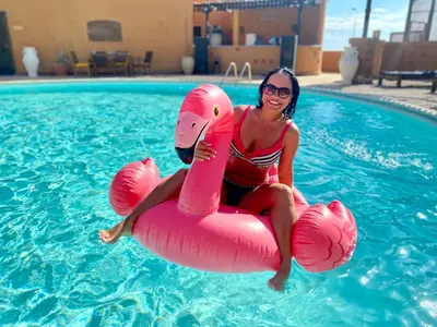 a woman in a pool with at Marina view port ghalib in Port Ghalib