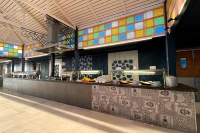 a kitchen with a counter with colorful tiles at Sentido Caribbean World Soma Bay in Hurghada