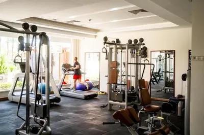 a woman in a gym with several machines at Sentido Caribbean World Soma Bay in Hurghada