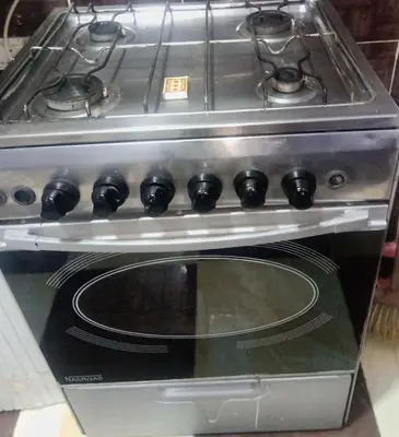a stove with a stove top oven in a kitchen at Yasin - Enjoy the privacy of staying in a quiet apartment with free Wi-Fi as your complete second home in the heart of Hurghada in Hurghada