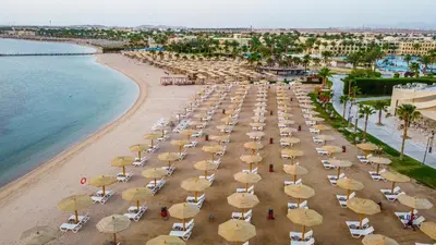 an aerial view of a beach with umbrellas at Xanadu Makadi Bay - High Class All Inclusive in Hurghada