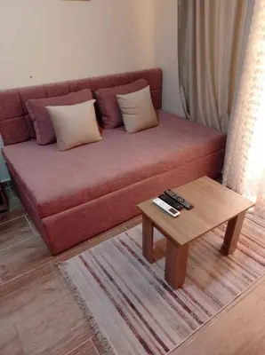 a living room with a couch and a coffee table at Florenza khamsin home Hurghada in Hurghada