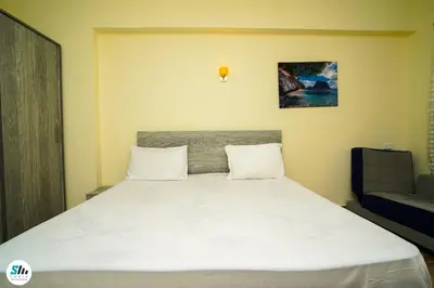 a bedroom with a large white bed in a room at Florenza khamsin home Hurghada in Hurghada