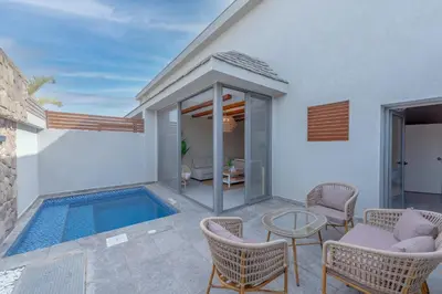 a villa with a swimming pool and a patio at Modern 1 Bedroom Apartment Bali El Gouna Private Patio & Heated Pool in Hurghada