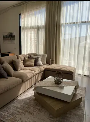 a living room with a couch and a coffee table at Somabay BW Villa - families only in Hurghada