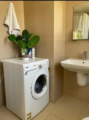 a washing machine in a bathroom with a sink at Somabay BW Villa - families only in Hurghada
