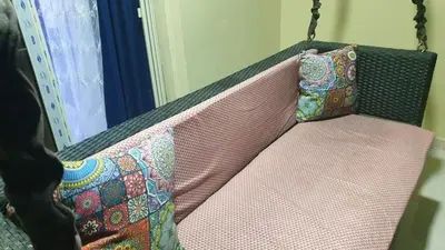 a couch with two pillows sitting on it at Casablanca resort in Hurghada