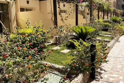 a garden with flowers and plants in a building at Florenza Khamsin - sea view / free Wi-Fi in Hurghada