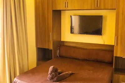 a stuffed teddy bear laying on top of a bed at Florenza Khamsin - sea view / free Wi-Fi in Hurghada