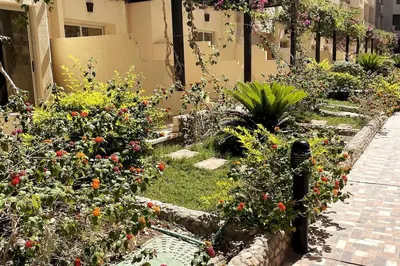 a garden with flowers and plants in a building at Florenza Khamsin - sea view / free Wi-Fi in Hurghada