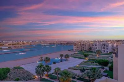 an aerial view of a city with a river and buildings at Sunny 2 Bedroom + Private Roof Terrace Lagoon View in Hurghada