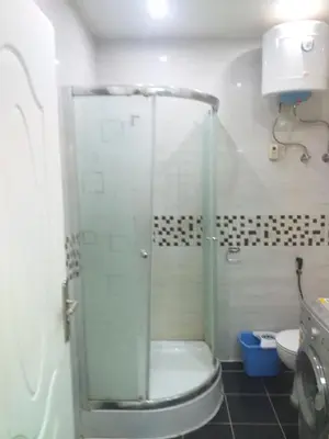 a bathroom with a shower with a toilet and a sink at sheraton 212 in Hurghada