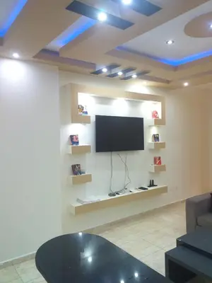 a living room with a flat screen tv on a wall at sheraton 212 in Hurghada