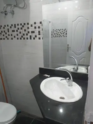 a bathroom with a sink and a toilet at sheraton 212 in Hurghada