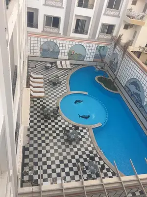 an overhead view of a swimming pool in a building at sheraton 212 in Hurghada