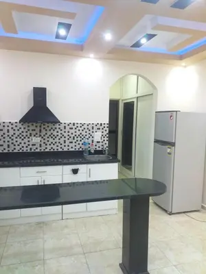 a kitchen with a refrigerator and a counter top at sheraton 212 in Hurghada